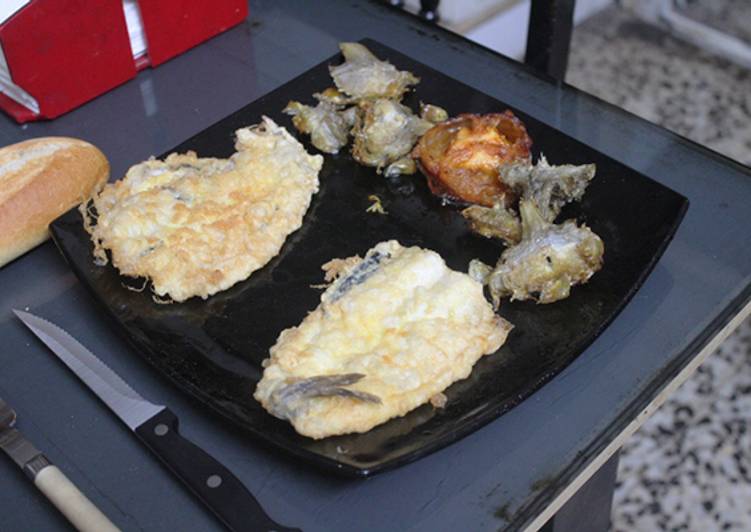 Bacaladilla con tomate y alcachofas confitadas