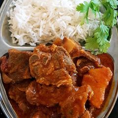 A picture of Beef Stew with Rice.