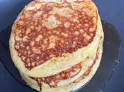 A picture of buttermilk pancake with maple syrup