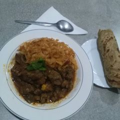 A picture of #themechallage goat stew and chapos.
