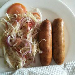 A picture of Cabbage salad with sausage.