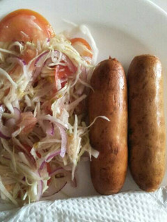 A picture of Cabbage salad with sausage.