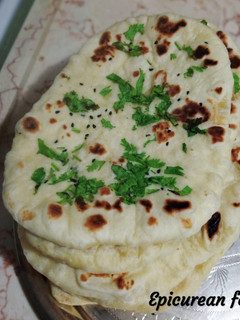 A picture of Kulcha Naan/ Indian flat bread.