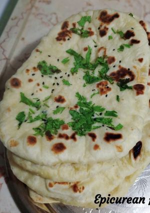 A picture of Kulcha Naan/ Indian flat bread.