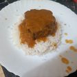 Lomo de cerdo en salsa de papaya y naranja sobre cama de arroz