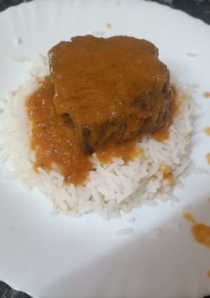 Foto principal de Lomo de cerdo en salsa de papaya y naranja sobre cama de arroz