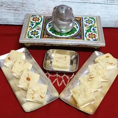 A picture of Paneer Coconut Barfi.- "where Devotion Turns into Dessert.".