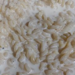 A picture of White sauce spiral pasta.