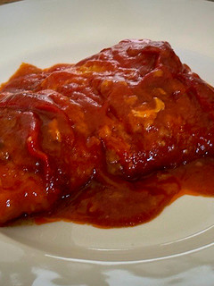 Una foto de Bacalao con tomate y pimientos
