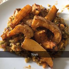 A picture of Cajun roast squash with rice and peas.
