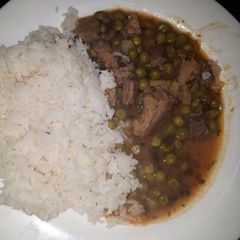 Rice served with peas stew A picture of Rice served with peas stew.