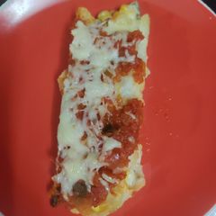A picture of Red sauce Enchiladas.
