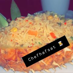 A picture of Fried rice served in a pineapple 🍍 pot.