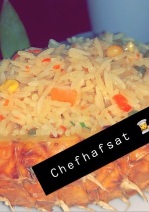 A picture of Fried rice served in a pineapple 🍍 pot.