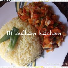 A picture of Vegetables soup with rice.