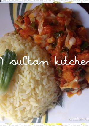 A picture of Vegetables soup with rice.