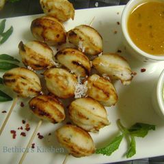 A picture of Skewered Kuzhi Paniyaram.