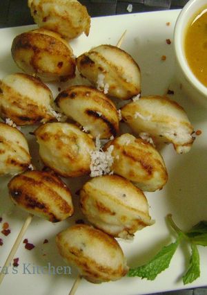 A picture of Skewered Kuzhi Paniyaram.