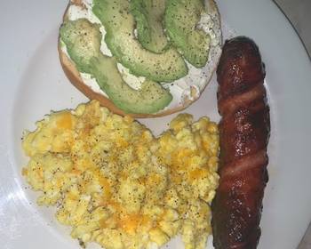 Fresh, Serving Recipe Avocado bagel with cheesy eggs and pineapple smoked sausage Practical Delicious