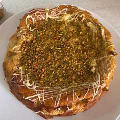 Una foto de Tarta de queso con pistachos