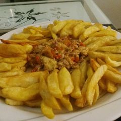 A picture of Chips with egg sauces.