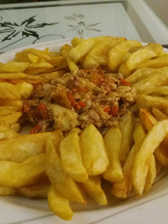 A picture of Chips with egg sauces.