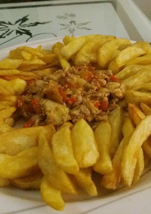 A picture of Chips with egg sauces.