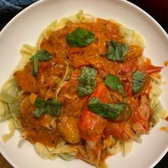 A picture of Crab Fettuccini w roasted tomato sauce.
