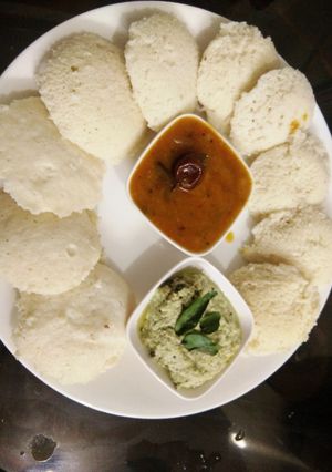 A picture of Healthy Oats Stuffed Soft Idli Sambhar with coconut chutney.