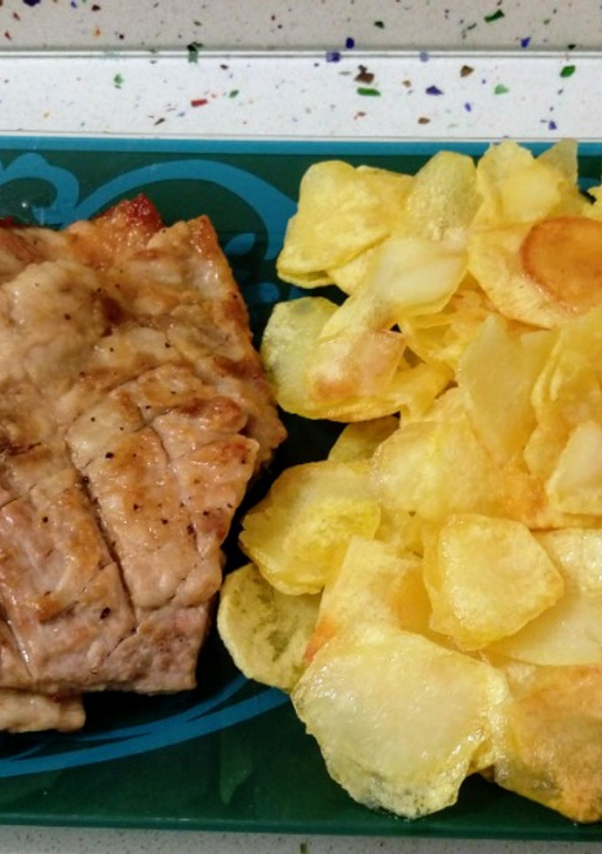 Una foto de Presa ibérica a la plancha y patatas fritas