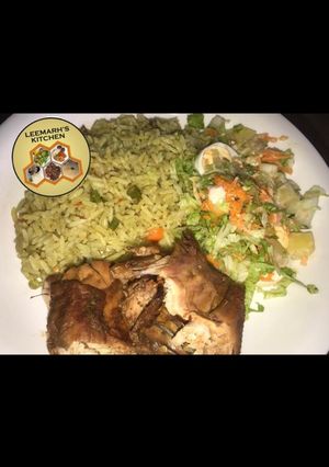 A picture of Fried rice, fried chicken and coeslow.