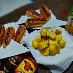 A picture of Hotdog's in two ways and some fried potatoes.