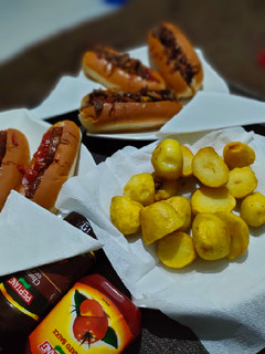A picture of Hotdog's in two ways and some fried potatoes.