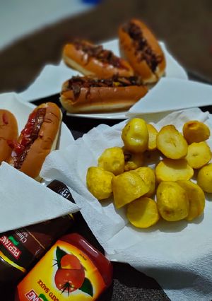 A picture of Hotdog's in two ways and some fried potatoes.