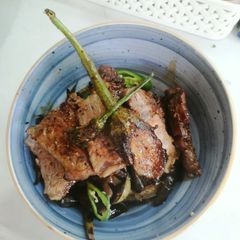 A picture of Steak with grilled veggies.