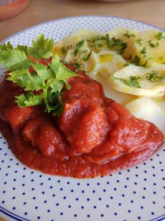 Una foto de Magro con tomate malagueño