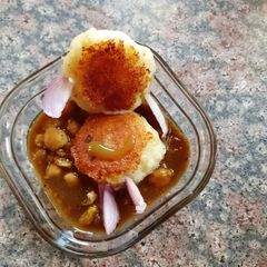 A picture of Aalu paneer tikiya with chhole.