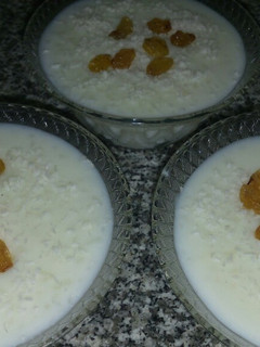 A picture of Rice Pudding with Whipped Cream Powder.