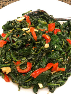A picture of Garlicky Spinach with Red Peppers.