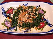 A picture of spinach with peanuts