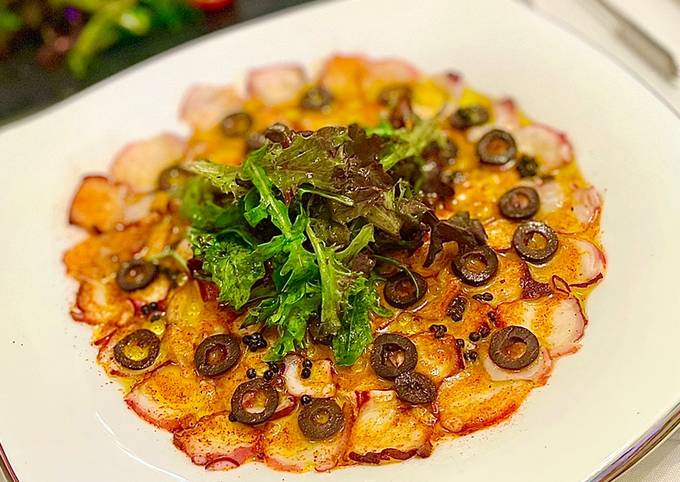Octopus Carpaccio in extra virgin oil oil and paprika powder