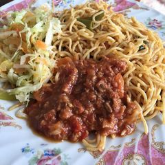 A picture of Tin fish with uncooked cabbage salad.