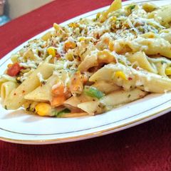 A picture of Vegtable white sauce pasta.