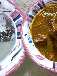 A picture of Amala and okro soup.