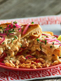Una foto de Sándwich de Puerco y Queso a la Tequila
