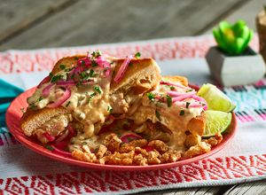 Una foto de Sándwich de Puerco y Queso a la Tequila
