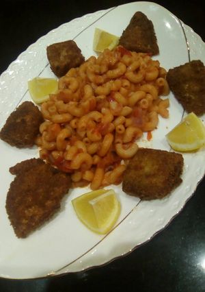 A picture of Pasta and fish fillet.