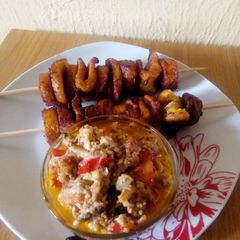 A picture of Skewed fried plantain and egg sauce.