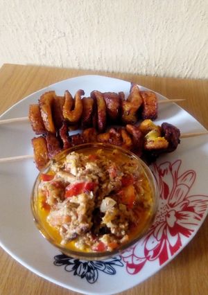 A picture of Skewed fried plantain and egg sauce.