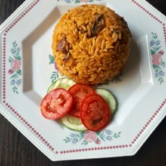 A picture of Jollof rice with dried fish.